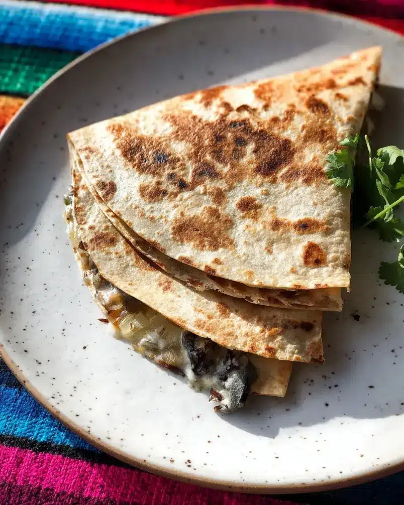Huitlacoche quesadillas 2 Huitlacoche being sauteed in a pan